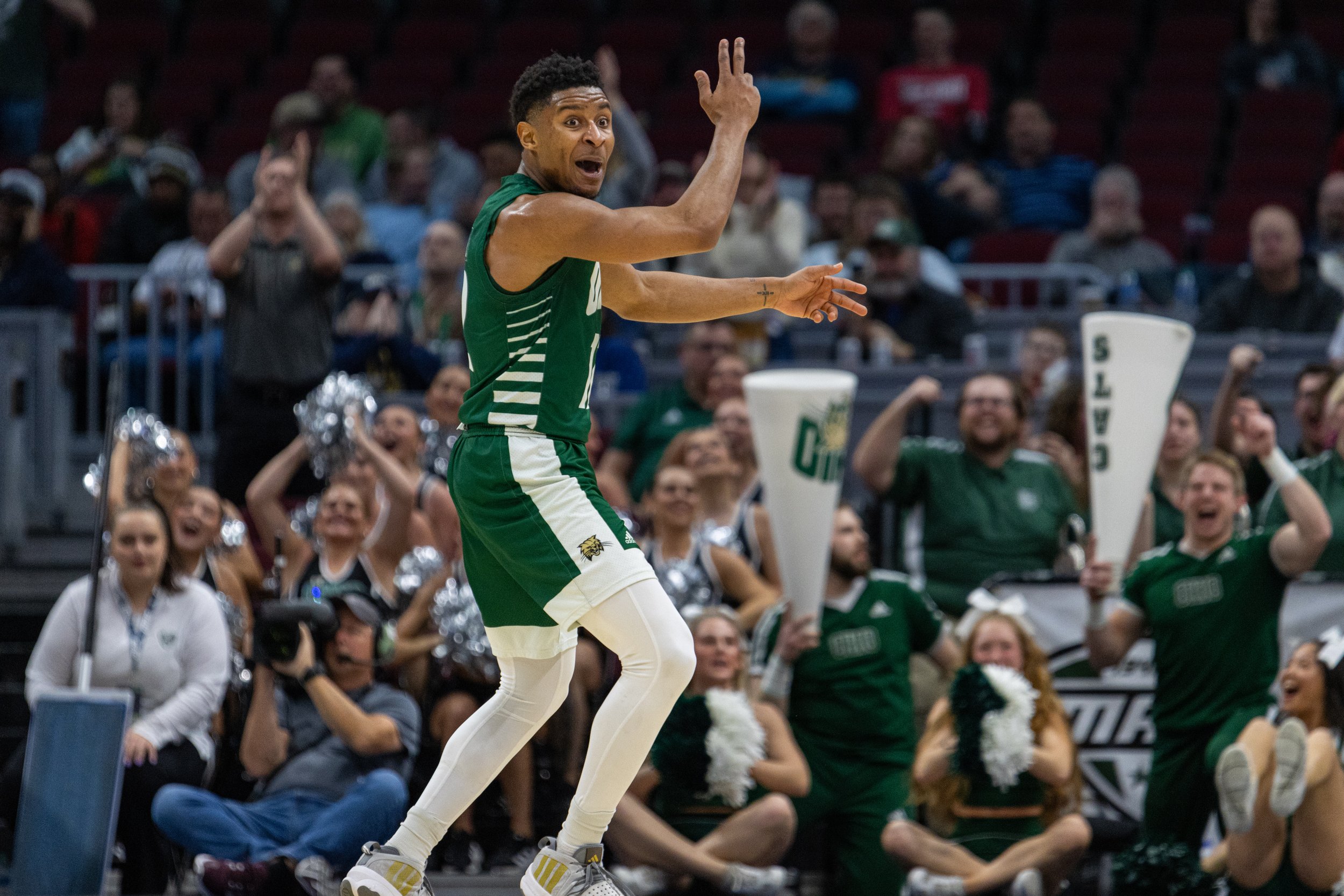 Ohio Bobcats guard Jaylin Hunter (12) celebrates after scoring three points against Akron in the MAC Men's Basketball Semifinals at Rocket Mortgage Fieldhouse in Cleveland, Ohio, Mar. 15, 2024. Hunter scored 17 points for Ohio, making him the team's