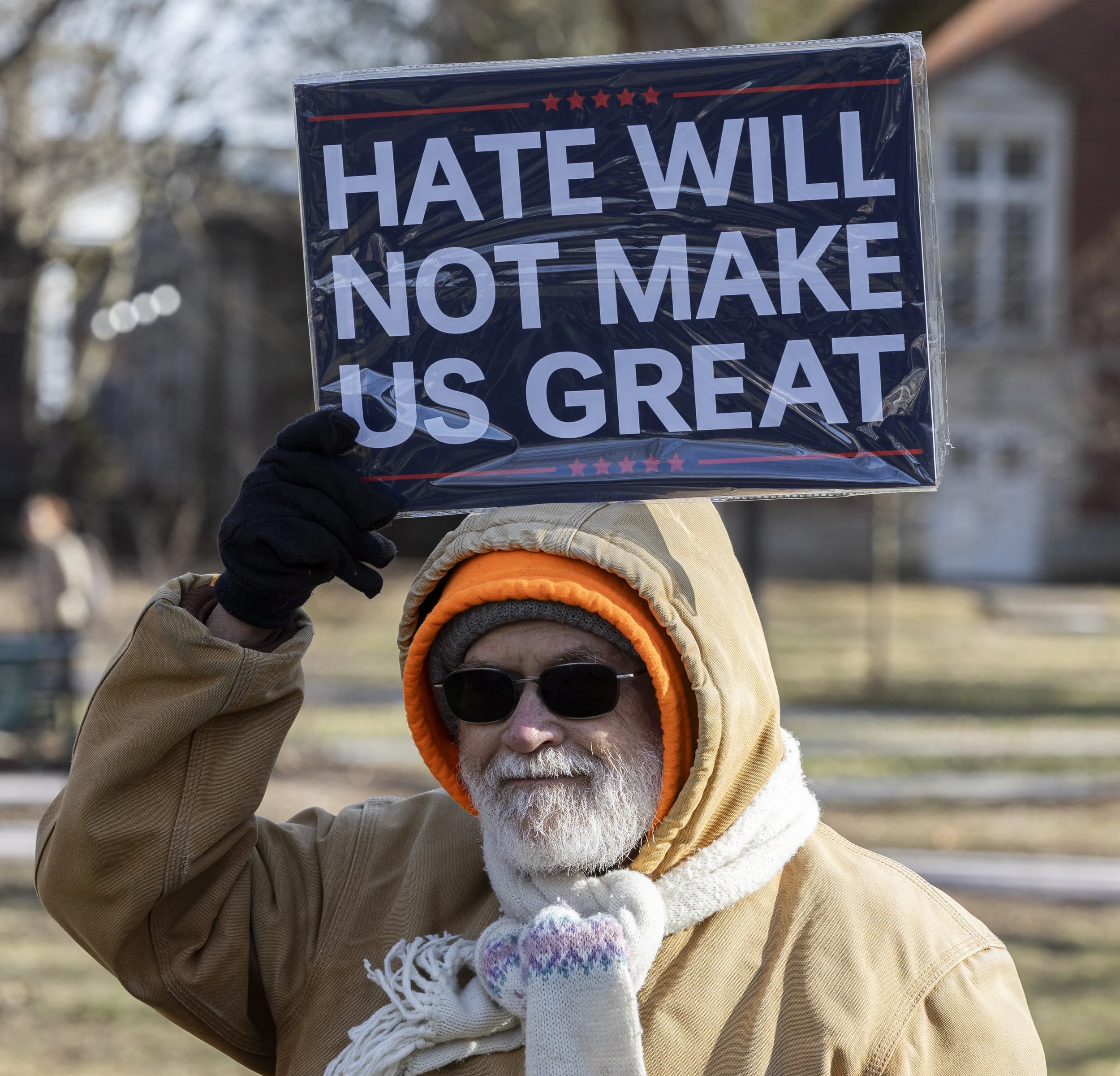 A protestor holds up a sign reading "Hate will not make us great" during a "No I.C.E." protest on College Green in Athens, Ohiom Jan. 23, 2026. The sign was styled to mock Donald Trump's campaign imagery. | For The Post