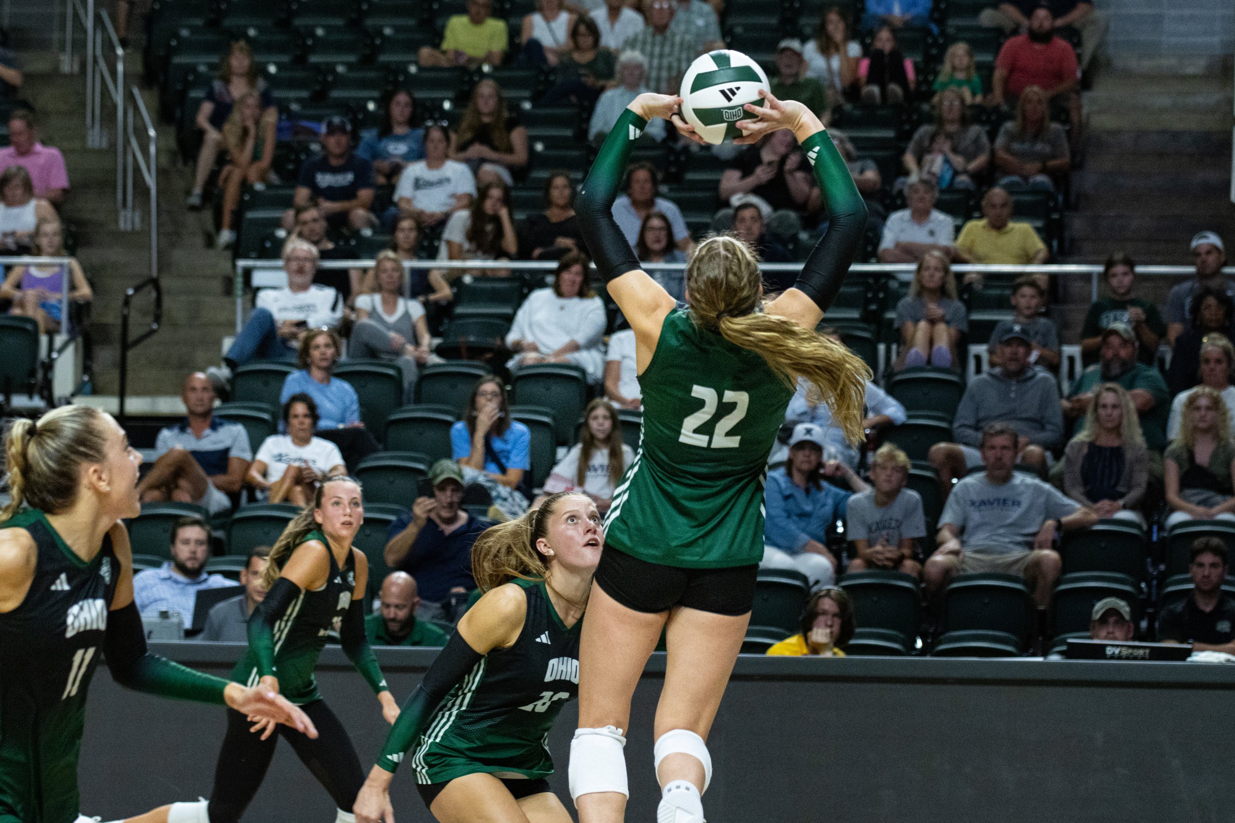Ohio Bobcats setter Chariti McKeller (22) goes for a set against Xavier at The Convo in Athens, Ohio, August 30, 2024. | Shot for The Post