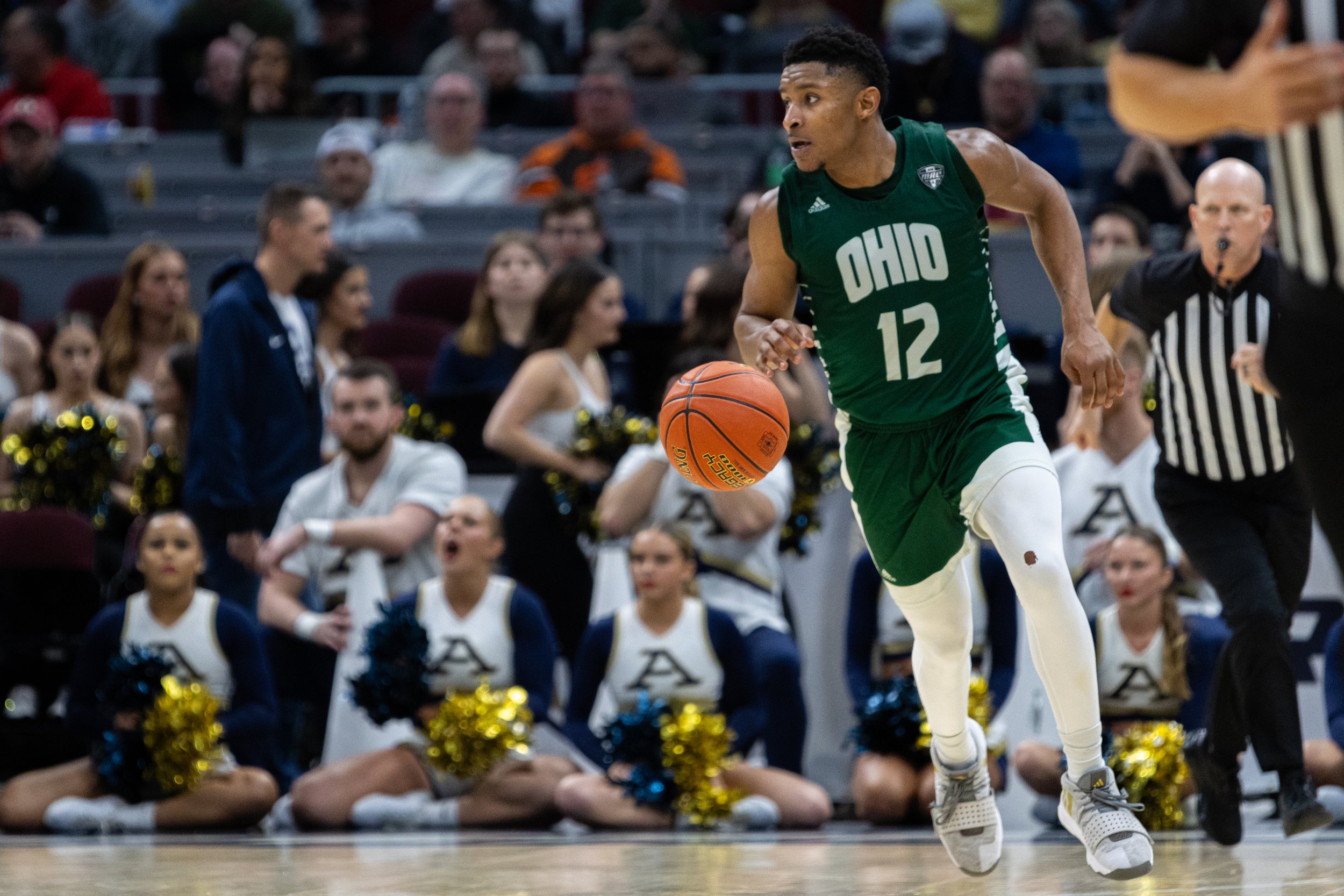 Ohio Bobcats guard Jaylin Hunter (12) dribbles down the court against Akron in the MAC Men's Basketball Semifinals at Rocket Mortgage Fieldhouse in Cleveland, Ohio, Mar. 15, 2024. Hunter scored 17 points for Ohio, making him the team's top scorer. T