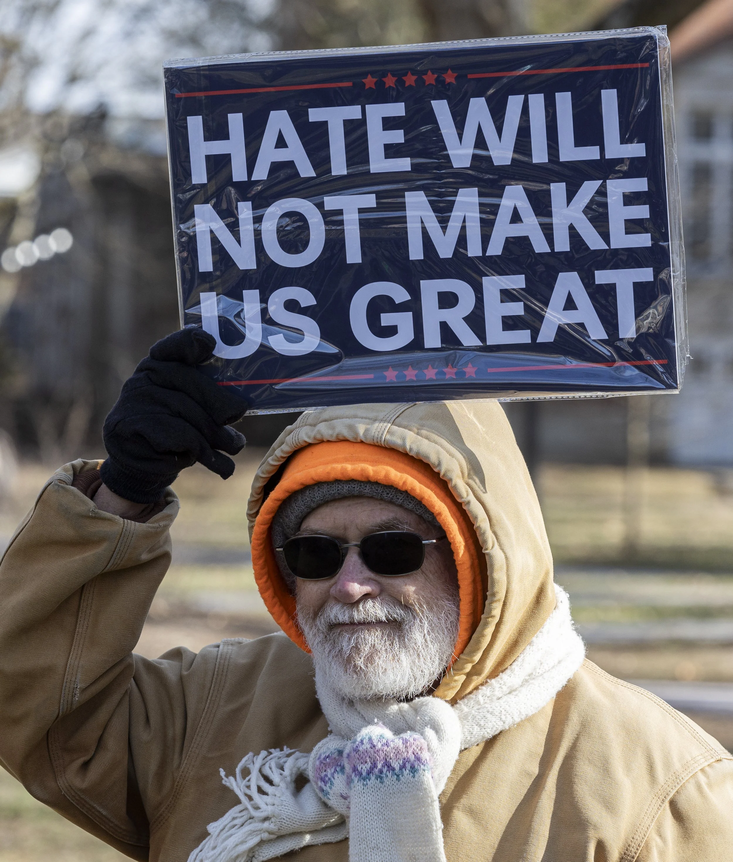 A protestor holds up a sign reading "Hate will not make us great" during an anti-I.C.E. protest on Ohio University's College Green in Athens, Ohio, Jan. 23, 2026. | For The Post