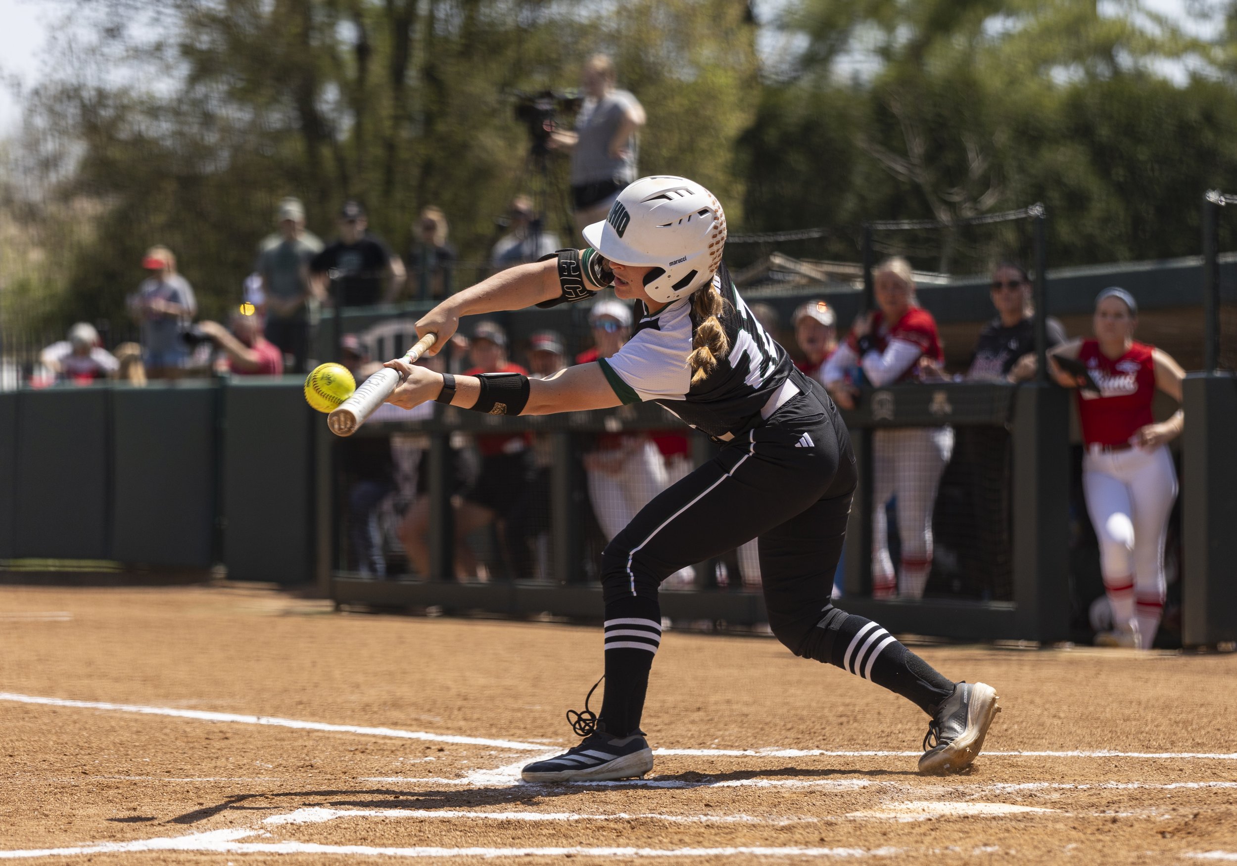 Ohio Bobcats outfielder Belle Hummel (22) bats against Miami at the Ohio Softball Field in Athens, Ohio, April 18, 2025.
