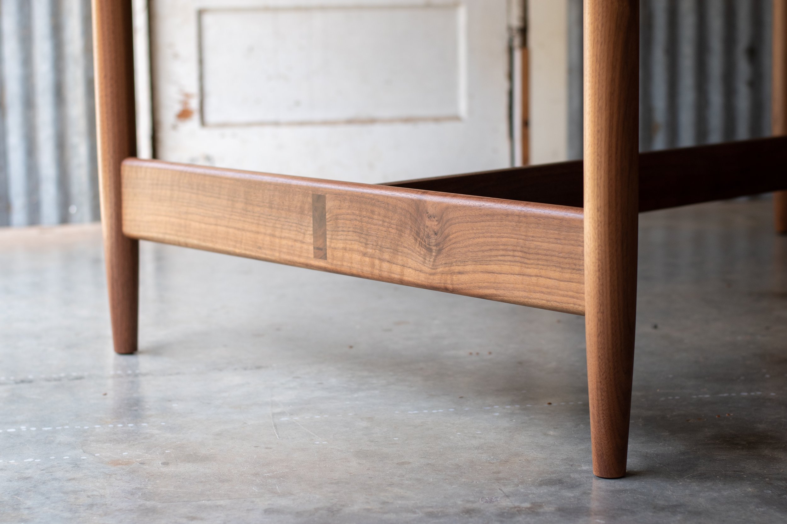 Wedged through-tenon joinery on the lower stretcher
