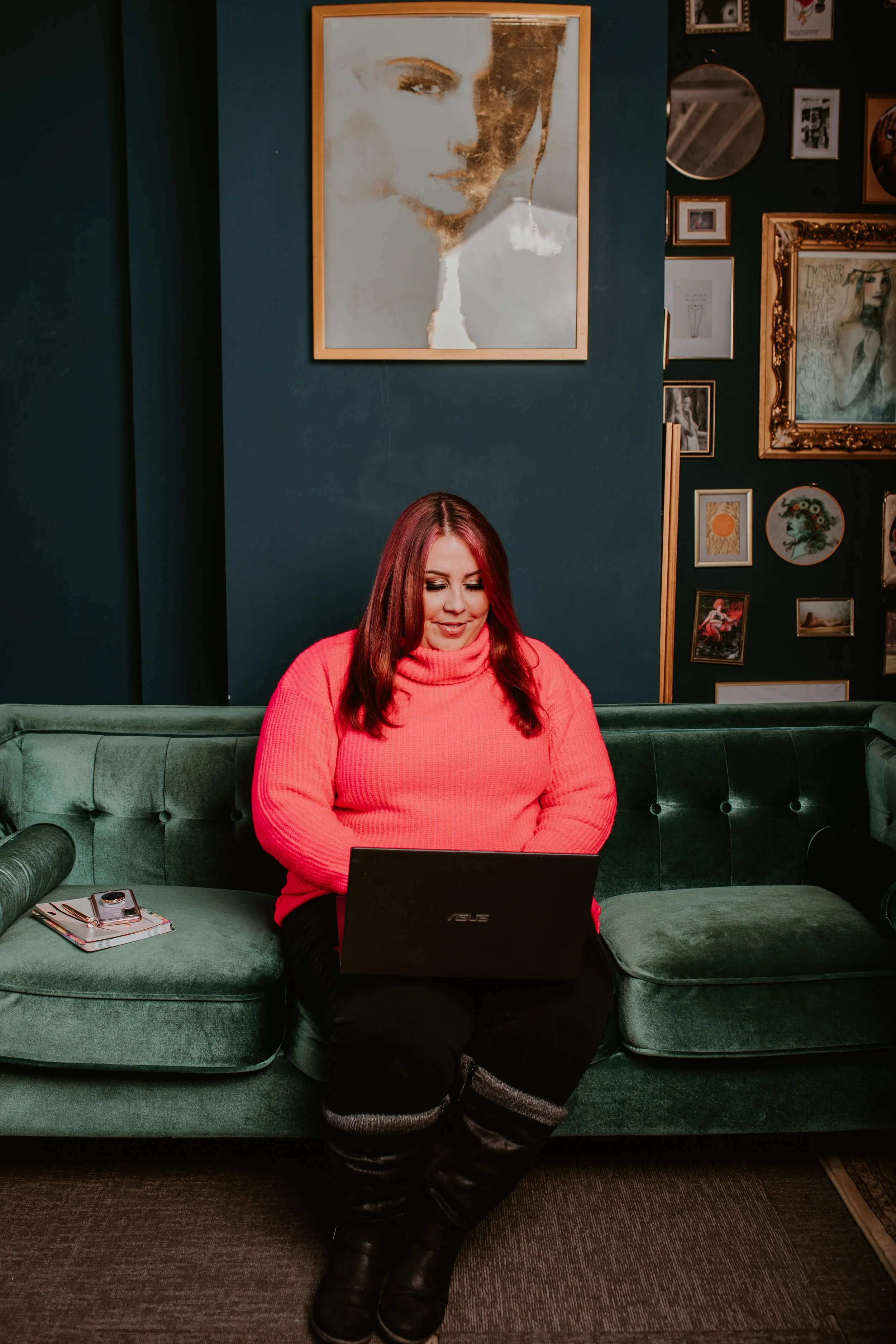 Winnipeg freelance writer Andrea Danelak types on a laptop while sitting on a couch.