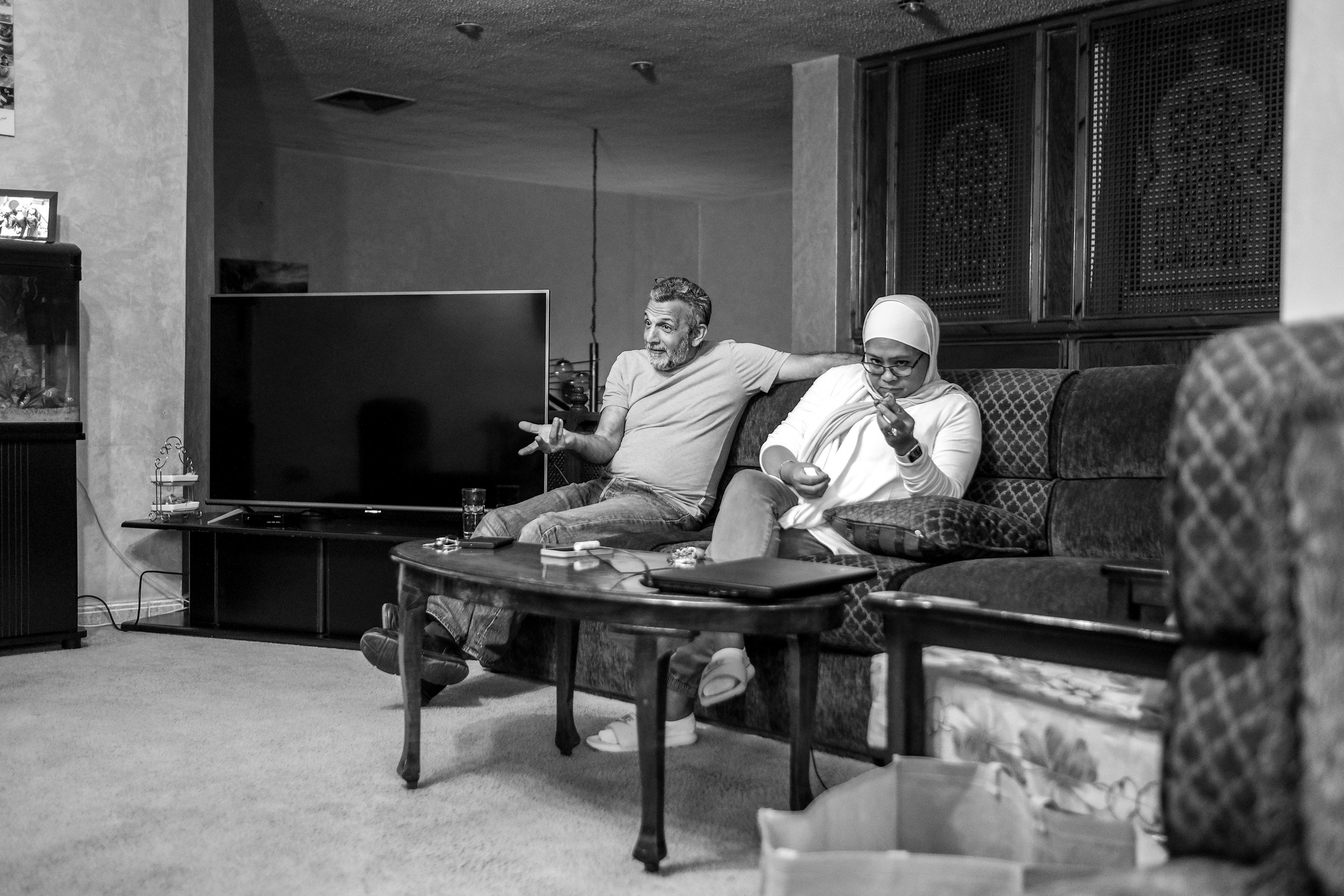 My father and mother in my grandmother’s house in Amman. My mother examining a peculiarly looking persimmon.