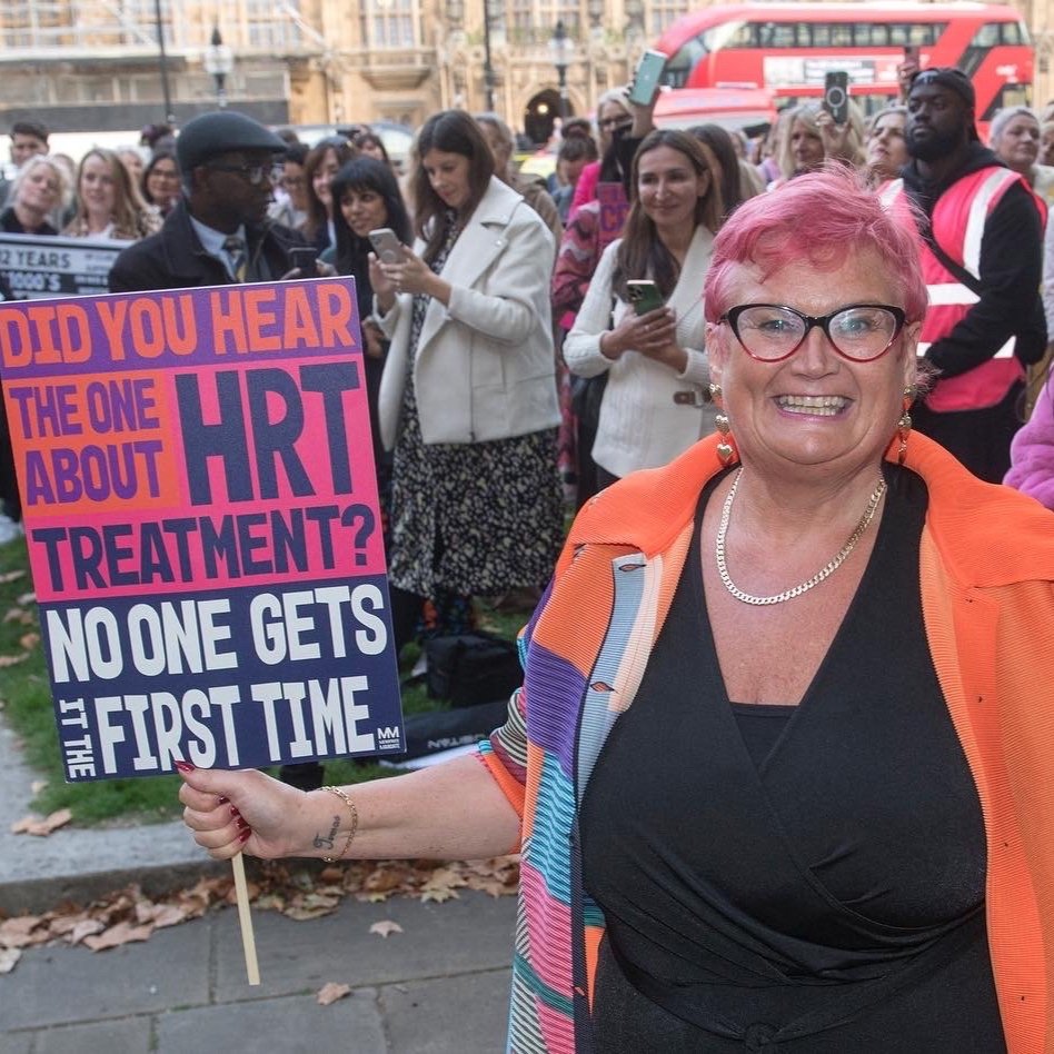 Carolyn Harris at World Menopause Day 2022 rally carrying placard