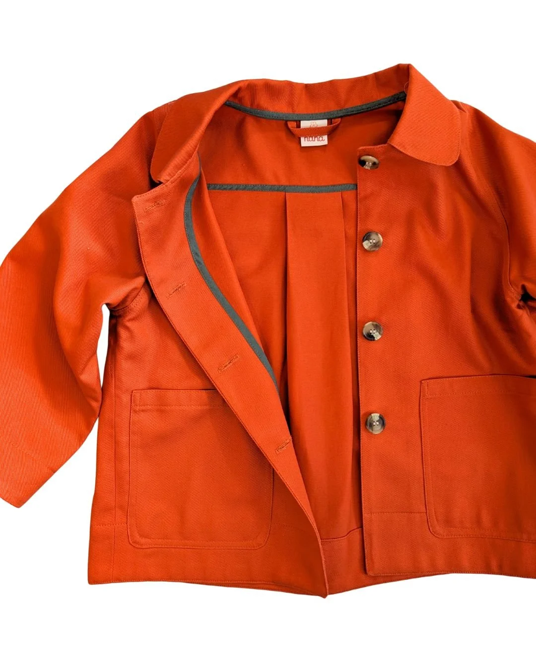 inside of bright orange Frankie chore jacket