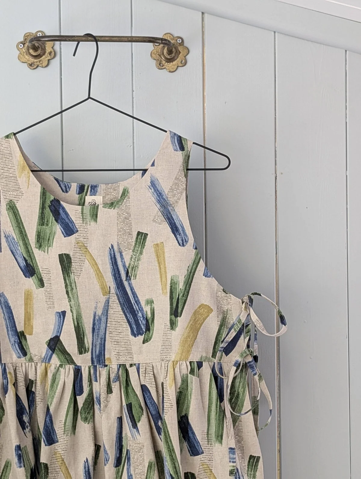 close up of paintbrush print tabard style top