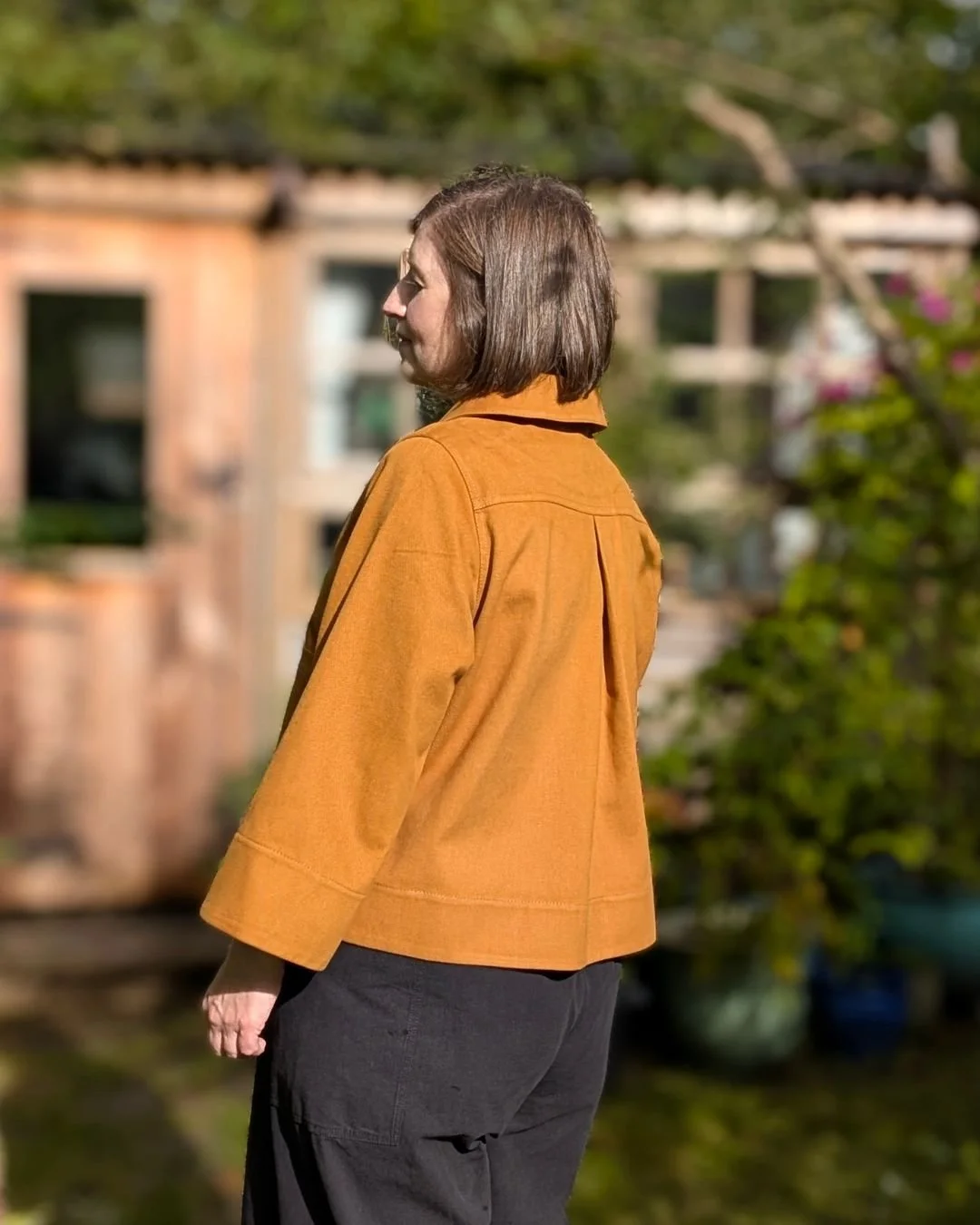 frankie chore jacket - ochre - back view on model.jpg