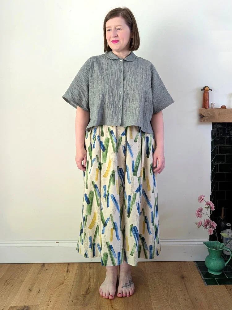 daisy brushstroke print skirt worn with the patty blouse by a model
