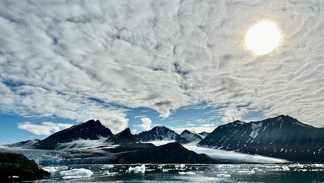 Arctic -Glacier Landscape with Sun in Sky.jpeg