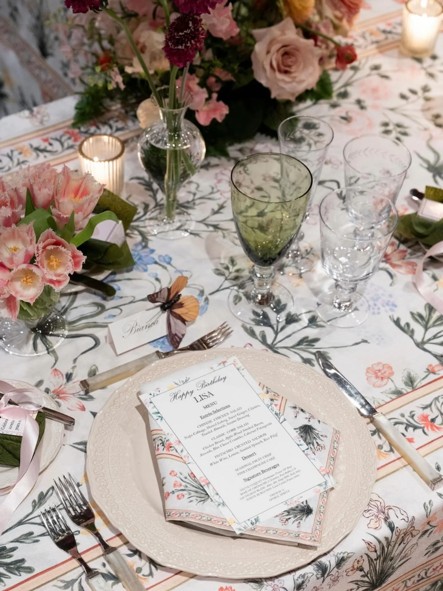 The tabletop is where every layer speaks.
A hand-tied ribbon. A menu wrapped like a keepsake. A bloom that nods to her favorite flower. Even the place cards held a whisper of whimsy.

Design is in the details, and for Lisa&rsquo;s table, each one was