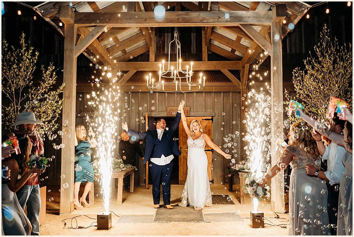 Bride and groom's grand exit with bubbles and fireworks | Lauren Crumpler Photography | Texas Wedding Photographer