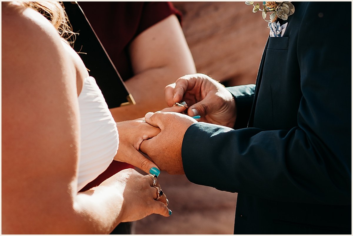 Bride and groom exchanging rings at cliffside ceremony | Lauren Crumpler Photography | Elopement Wedding Photographer