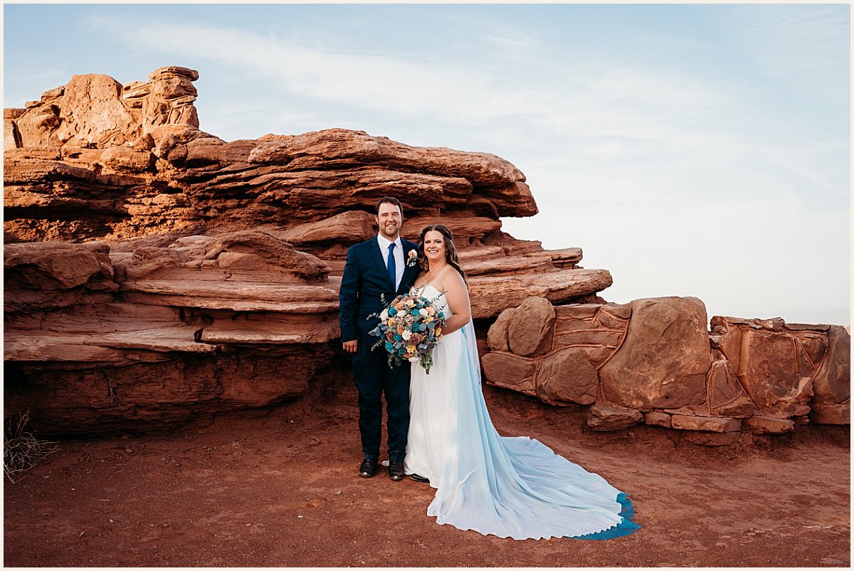 Bride and groom wedding portraits on cliffside mountain in Moab | Lauren Crumpler Photography | Elopement Wedding Photographer