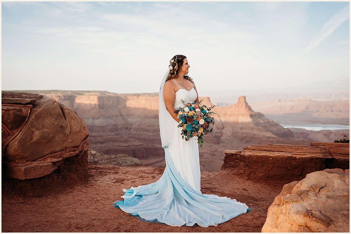 Bridal wedding portrait on cliffside mountain in Moab | Lauren Crumpler Photography | Elopement Wedding Photographer