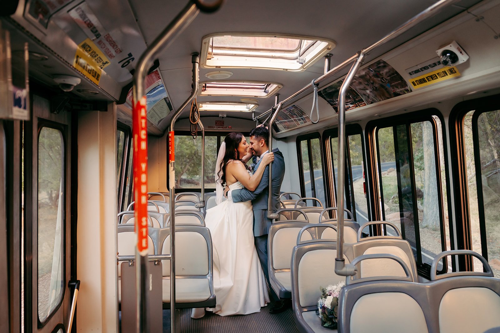  Bride and Groom kissing in a shuttle bus  