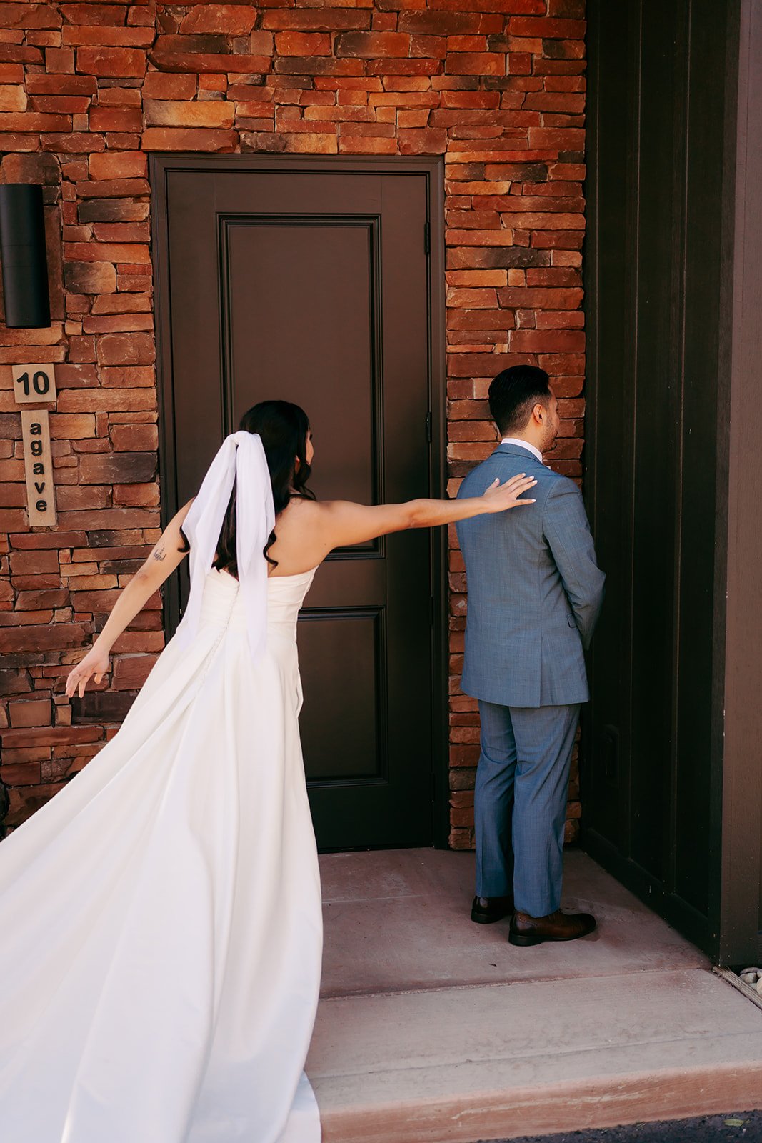  Bride touching the Groom’s shoulder  