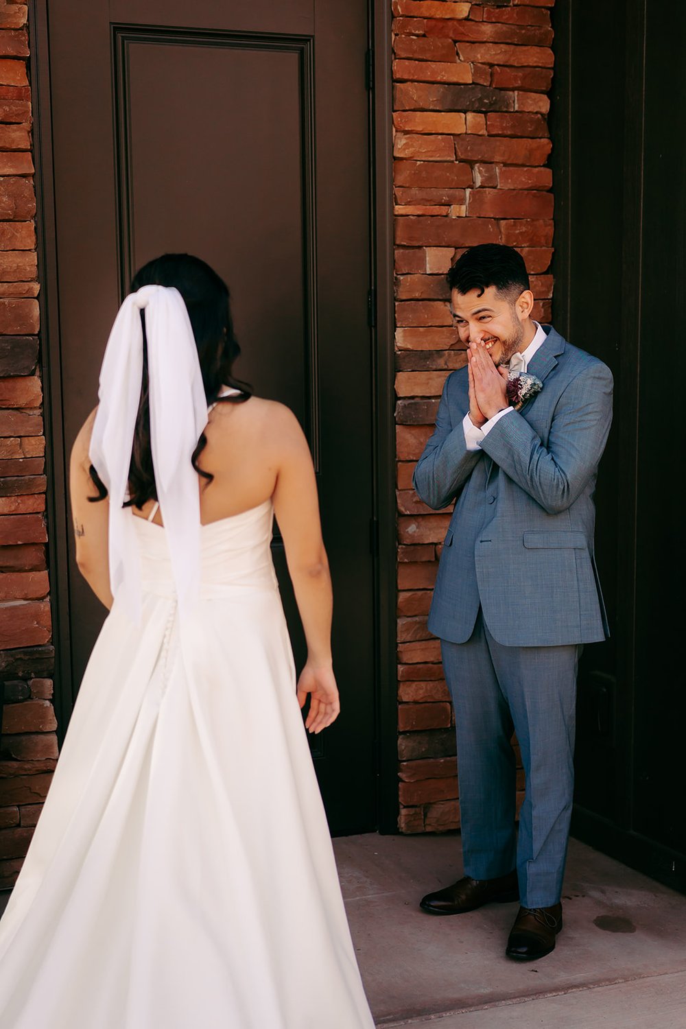  The groom is in awe looking at the bride 