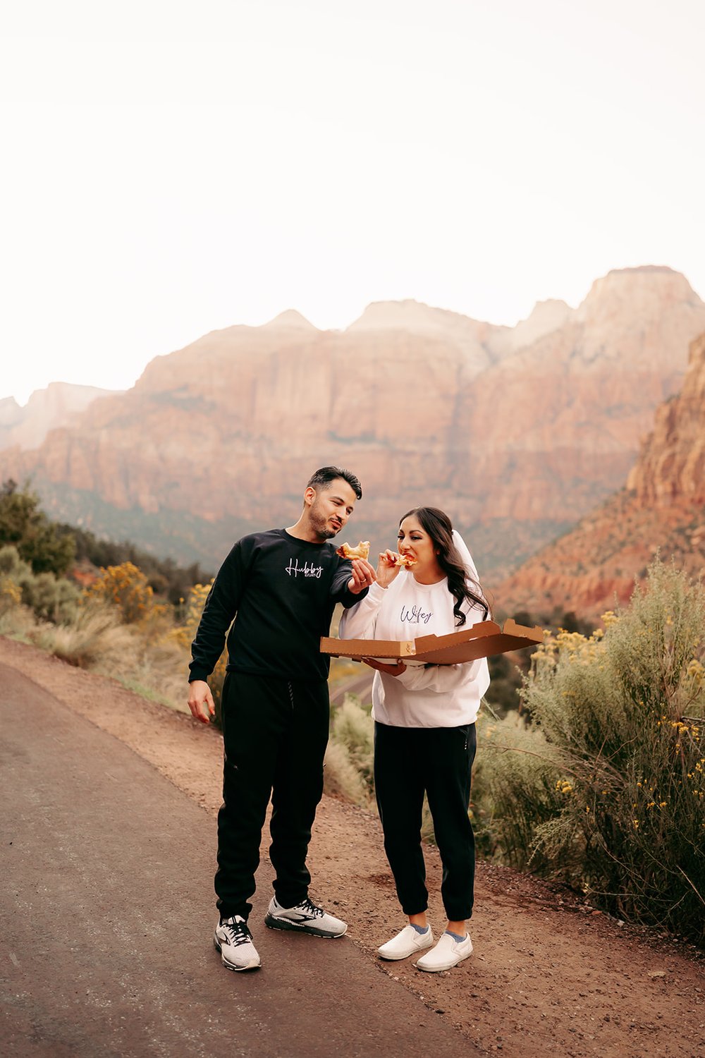  Bride and Groom enjoying a pizza after their elopement  