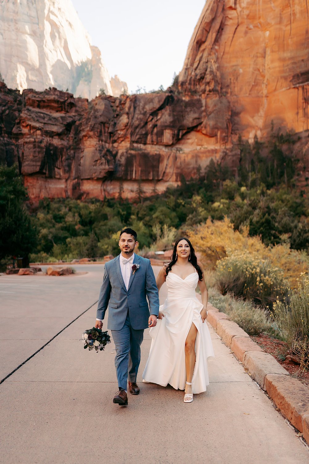  Bride and Groom holding hands during golden hour at Zion National Park 