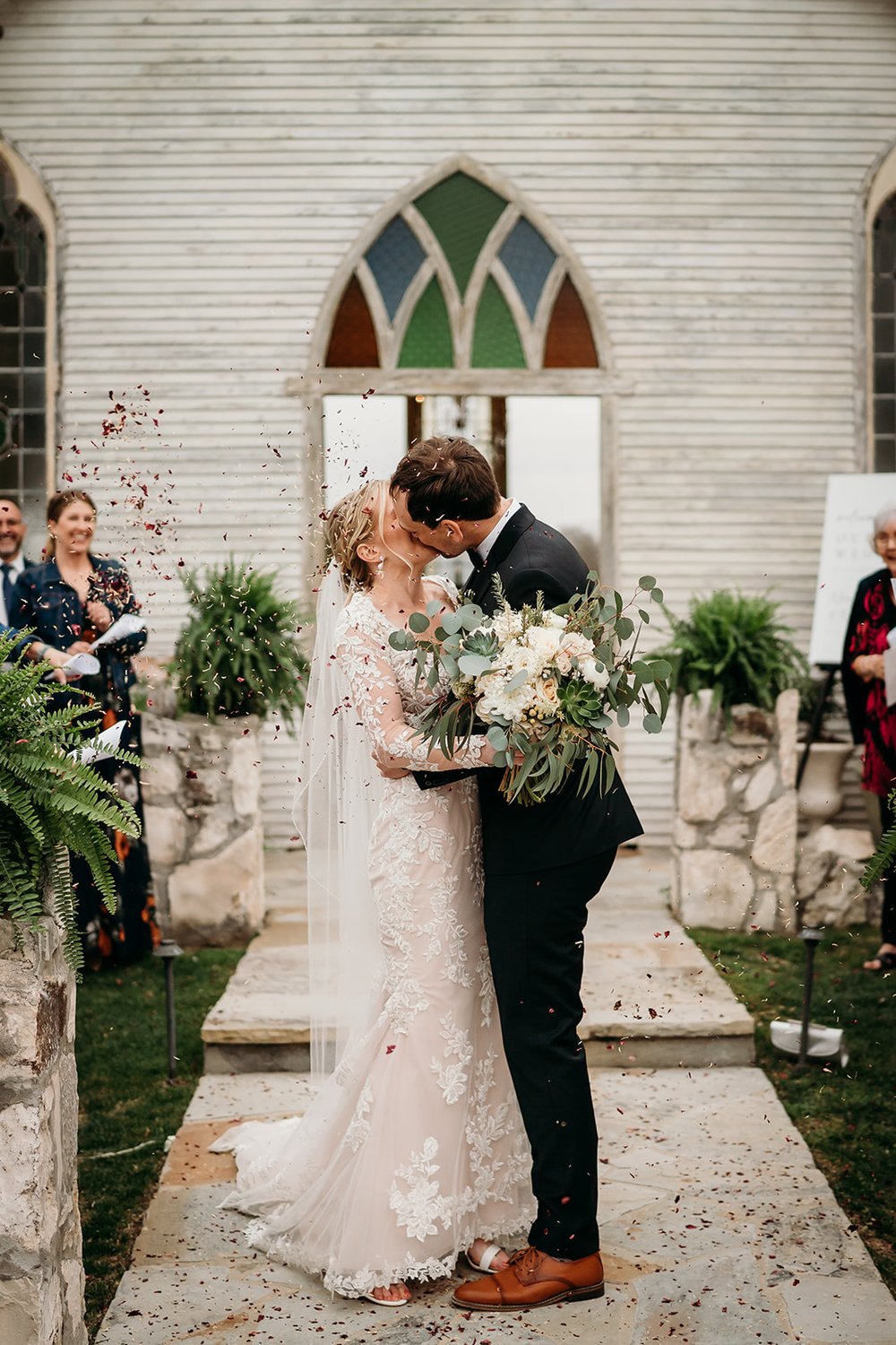  Bride and Groom kissing  after their ceremony 