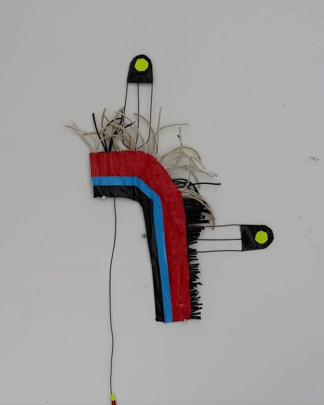 "Headroach". Found Materials. Wire. Duct Tape. Phone Charger cords. All rights reserved.