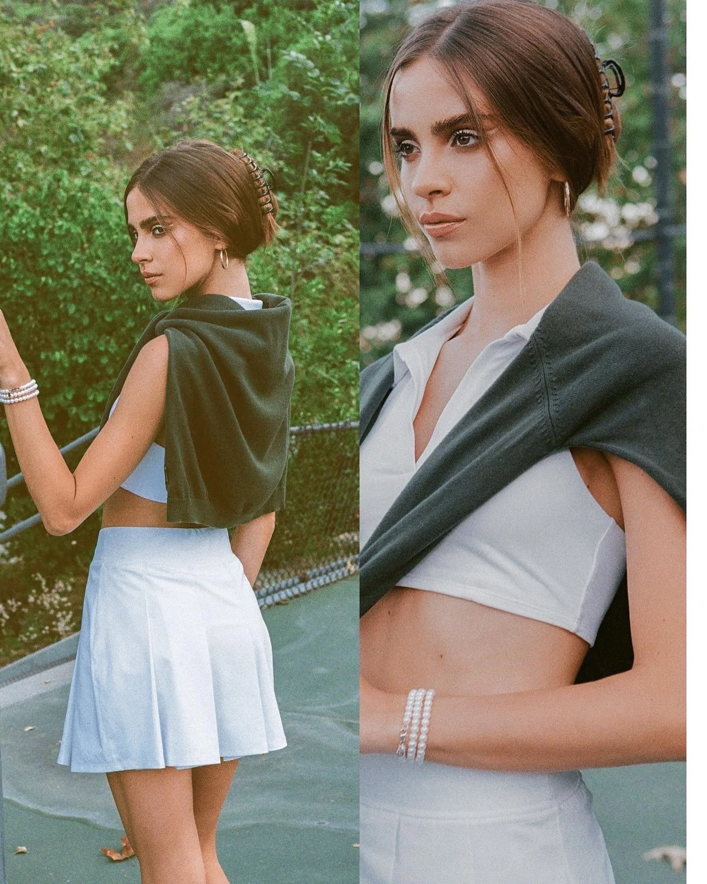 Woman in athletic attire with a white crop top, skirt, and dark jacket over shoulders on a tennis court.