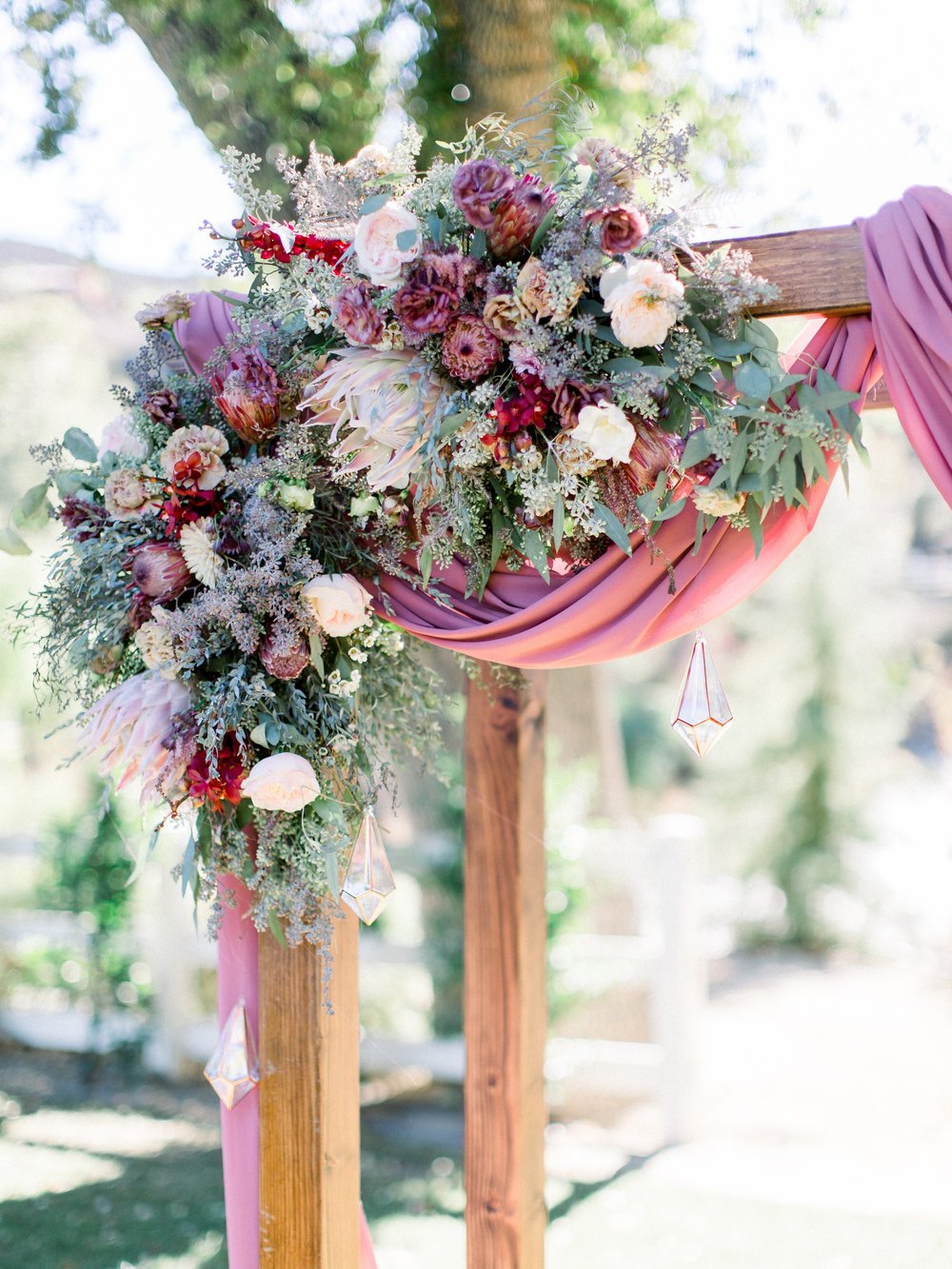wedding arbor mauve florals.jpeg