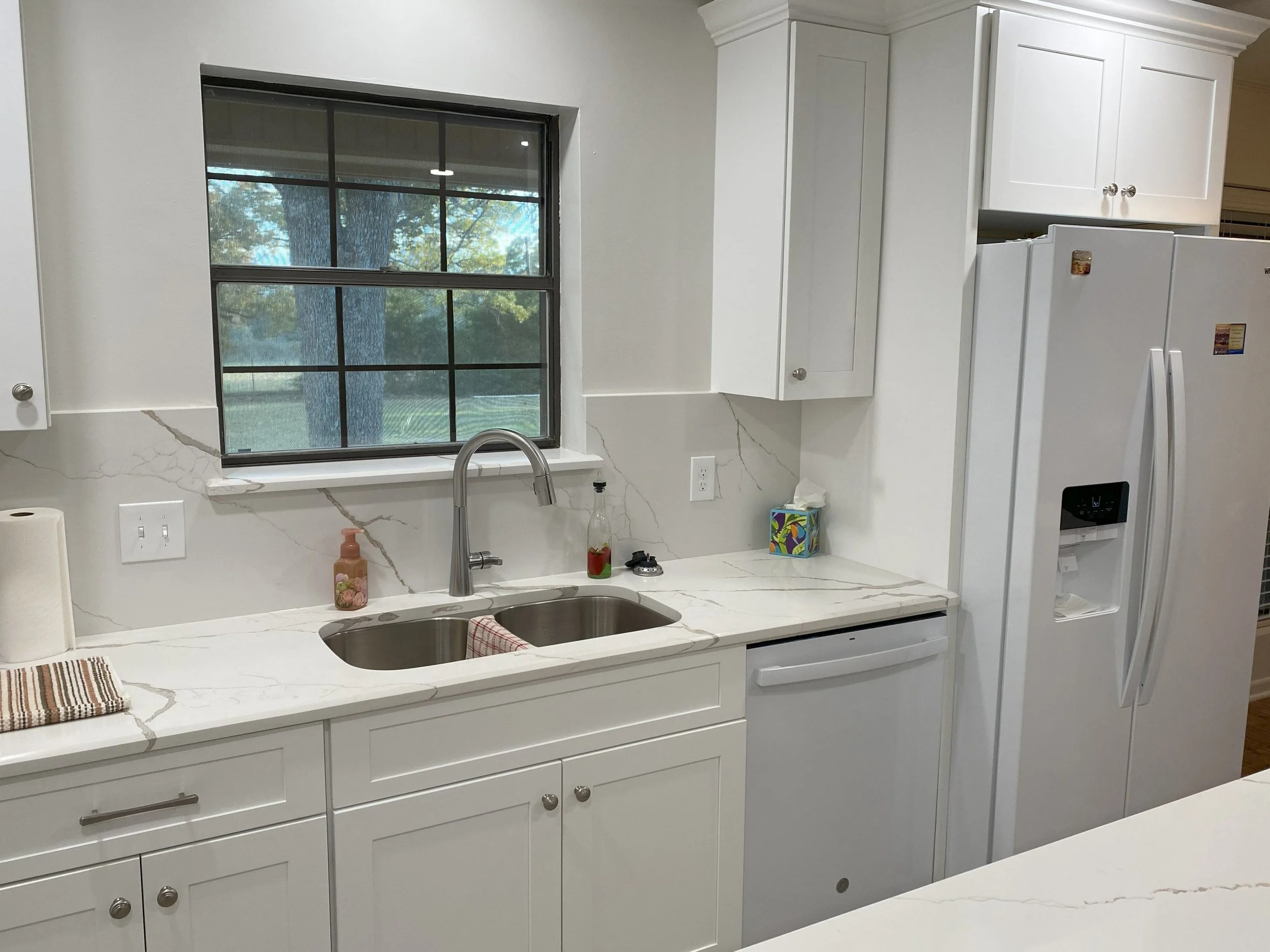 College Station LIG Kitchen Remodel Cararra quartz countertops, white tall cabinets, quartz backsplash 5.jpg