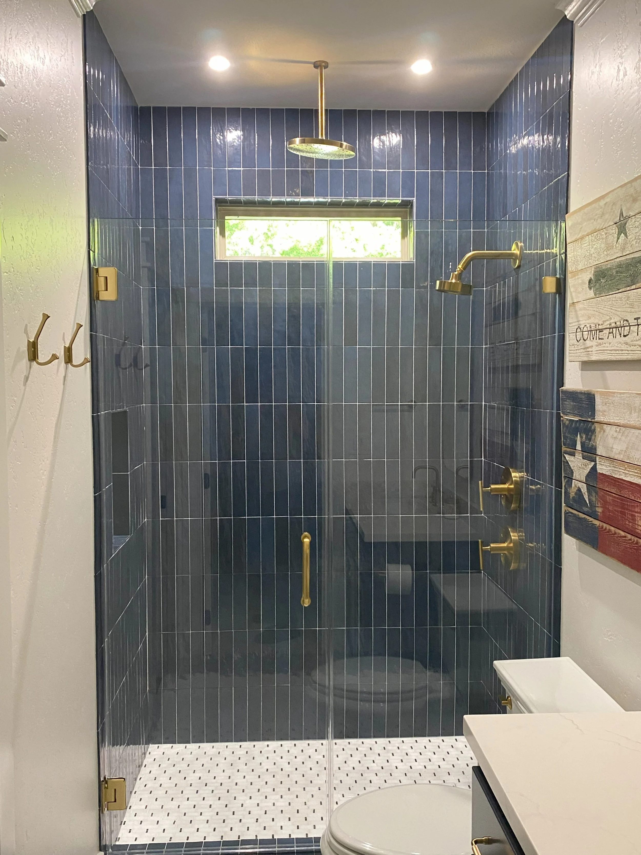 OLI Blue subway tile, gold trim, shower glass, new bath vanity 1.jpg