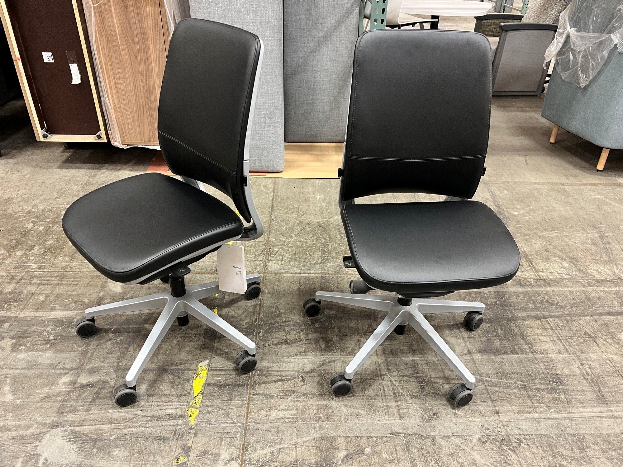 Steelcase Amia Chair Black leather seat and back, Armless, Platinum back and base. Qty: 2 | $200 each ($900 New)