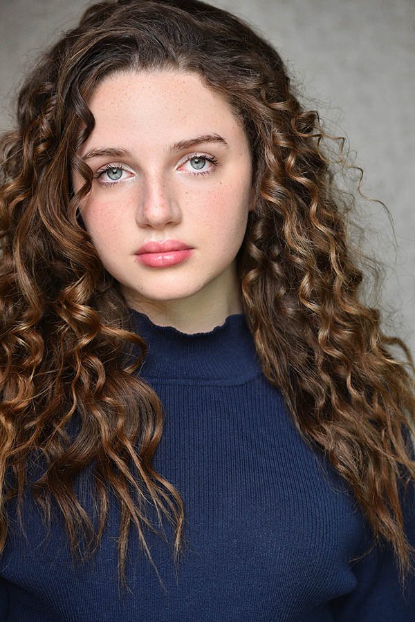 Young actress with curly hair - diverse actor headshots in Los Angeles by Marc Cartwright