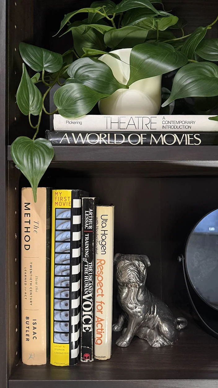A shelf of acting technique books, including works by Uta Hagen and Arthur Lessac, on display at Lucky Rabbit Self Tapes.
