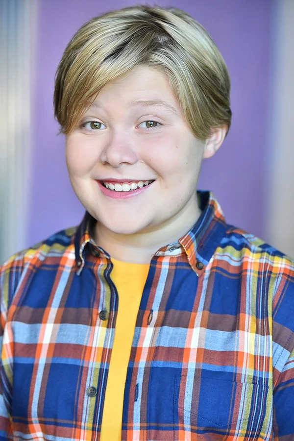 Commercial teen actor headshot featuring bright smile and approachable energy, photographed by Marc Cartwright Headshots in Studio City, Los Angeles. Perfect for TV and commercial auditions.