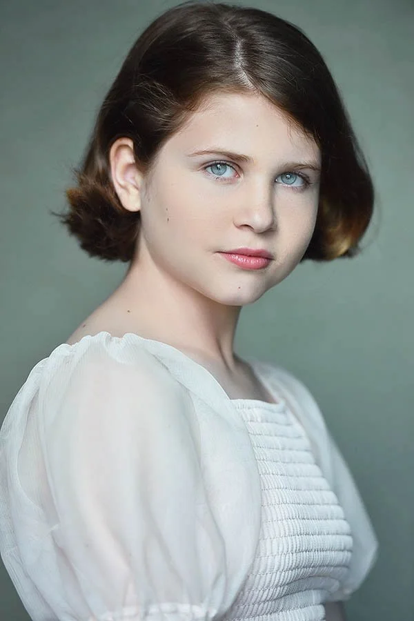 Child actor headshot with natural expression, photographed in Los Angeles for film and television submissions.