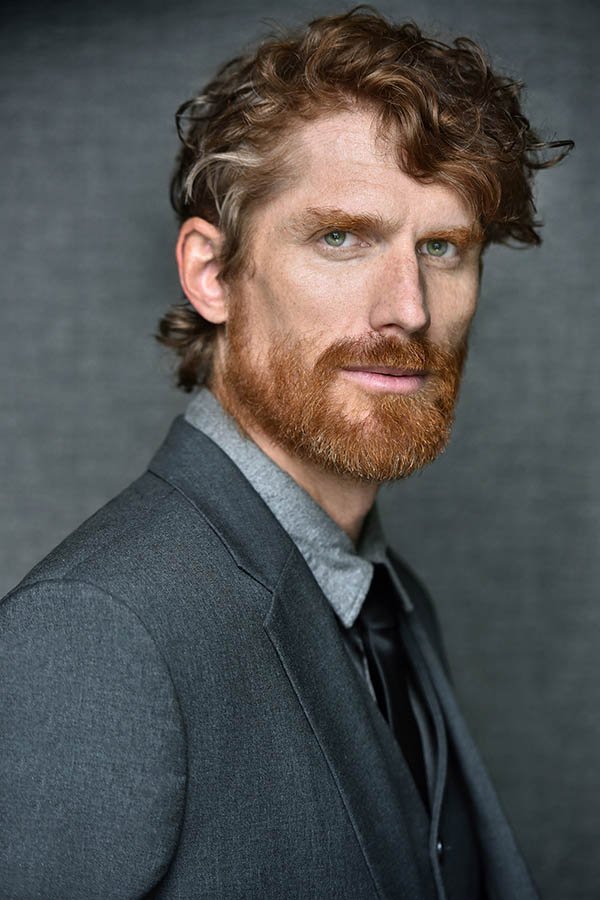 Actor headshot of a man with red hair and a red beard in a gray suit by Marc Cartwright in Los Angeles