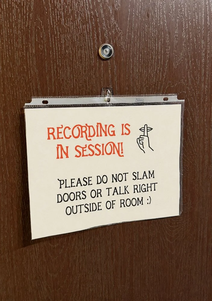 A handwritten "recording is in session" sign on the studio door at Lucky Rabbit Self Tapes, a self-tape studio for actors in Los Angeles.