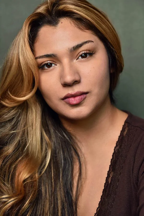 Close-up actress headshot with long brown hair and a natural, direct expression, photographed by Los Angeles headshot photographer Marc Cartwright.