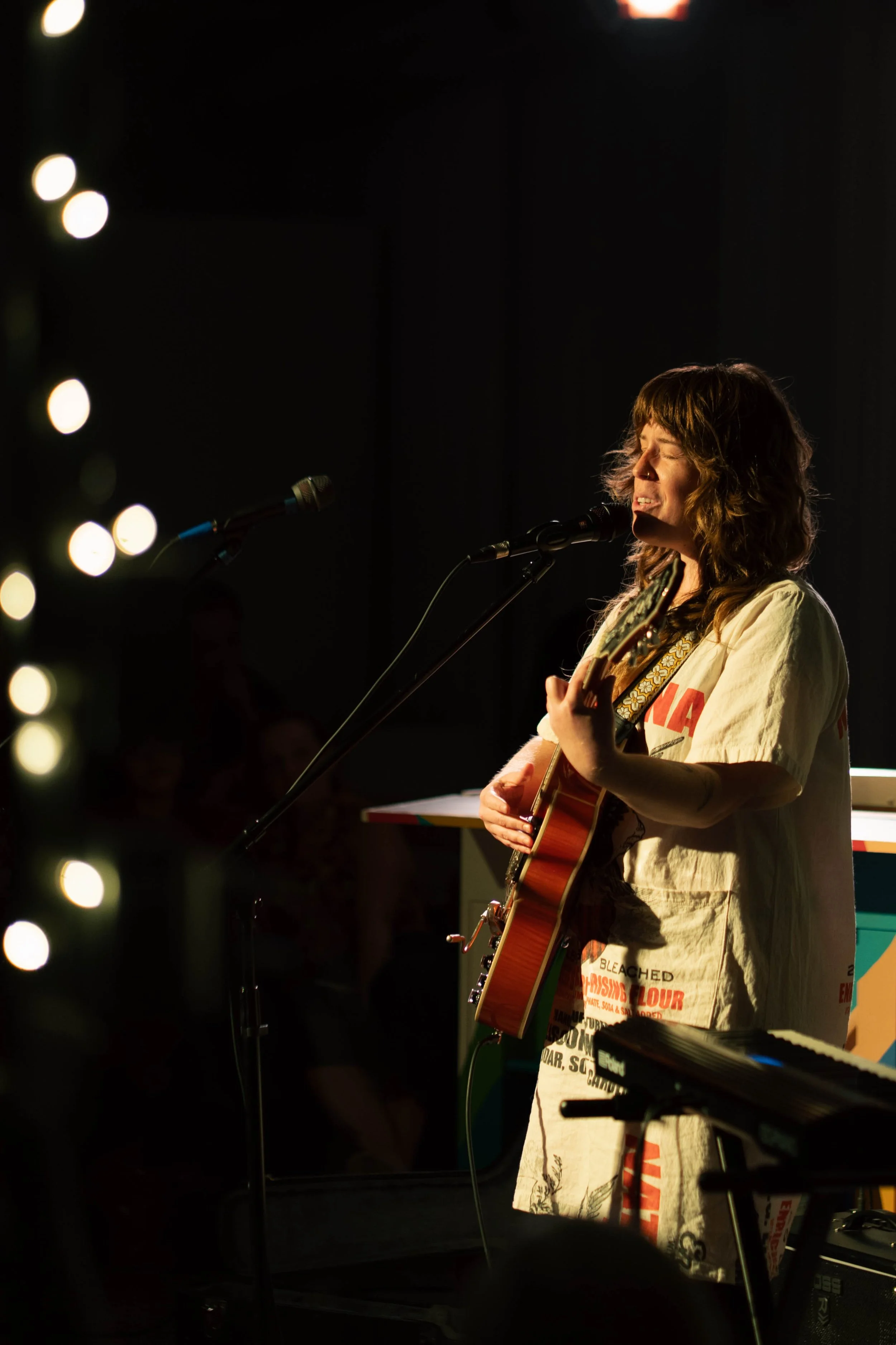 Hillary Watson, sing/songwriter performs solo with Epiphone hollow-body guitar