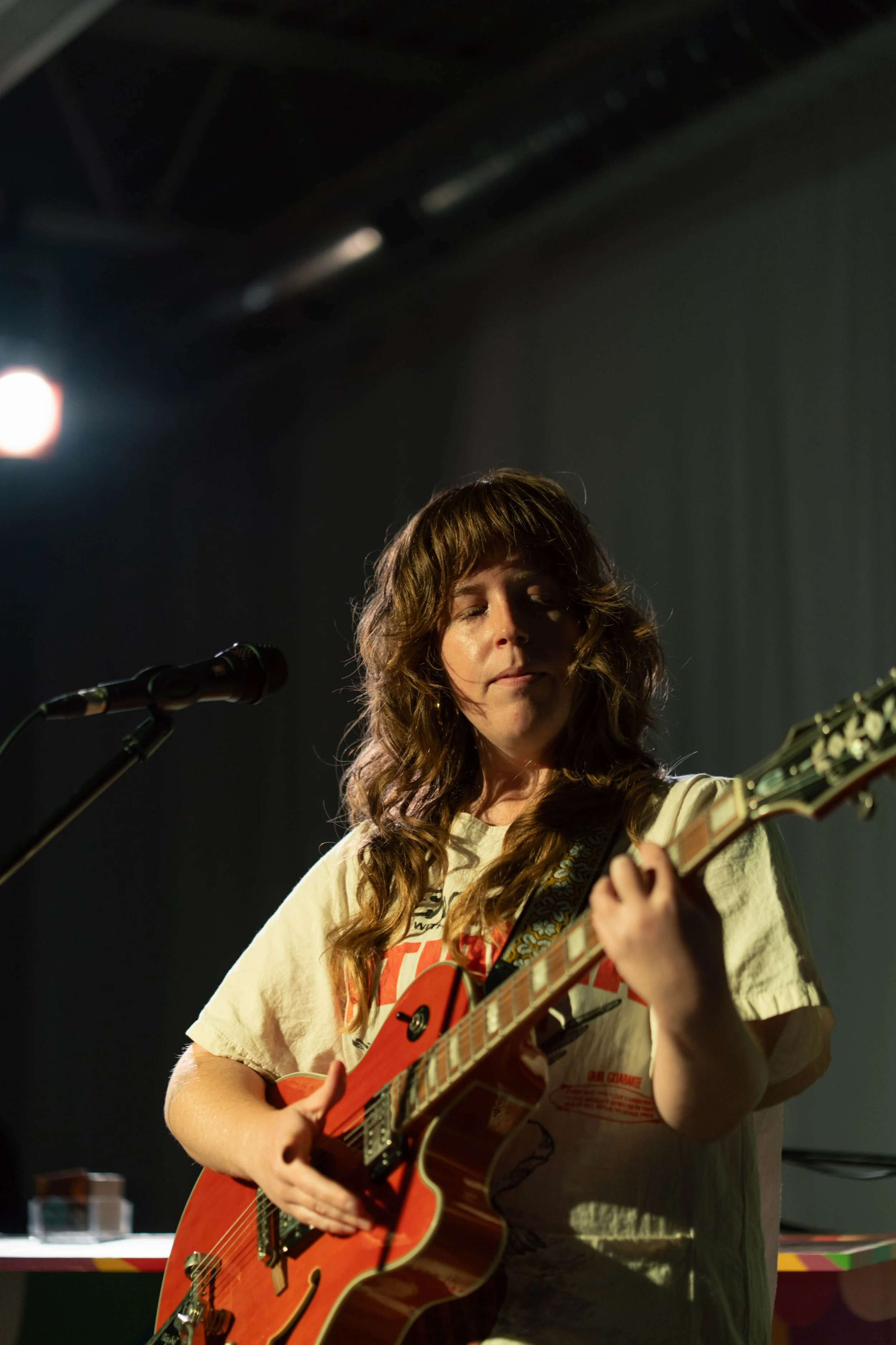 Hillary Watson singer/songwriter performs solo with Epiphone hollow-body guitar