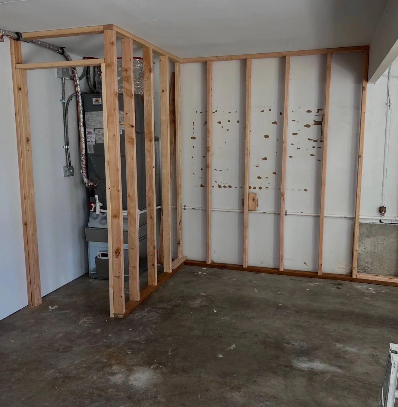 Garage framing modifications including utility concealment bump-outs and soffit construction in Kenmore WA.