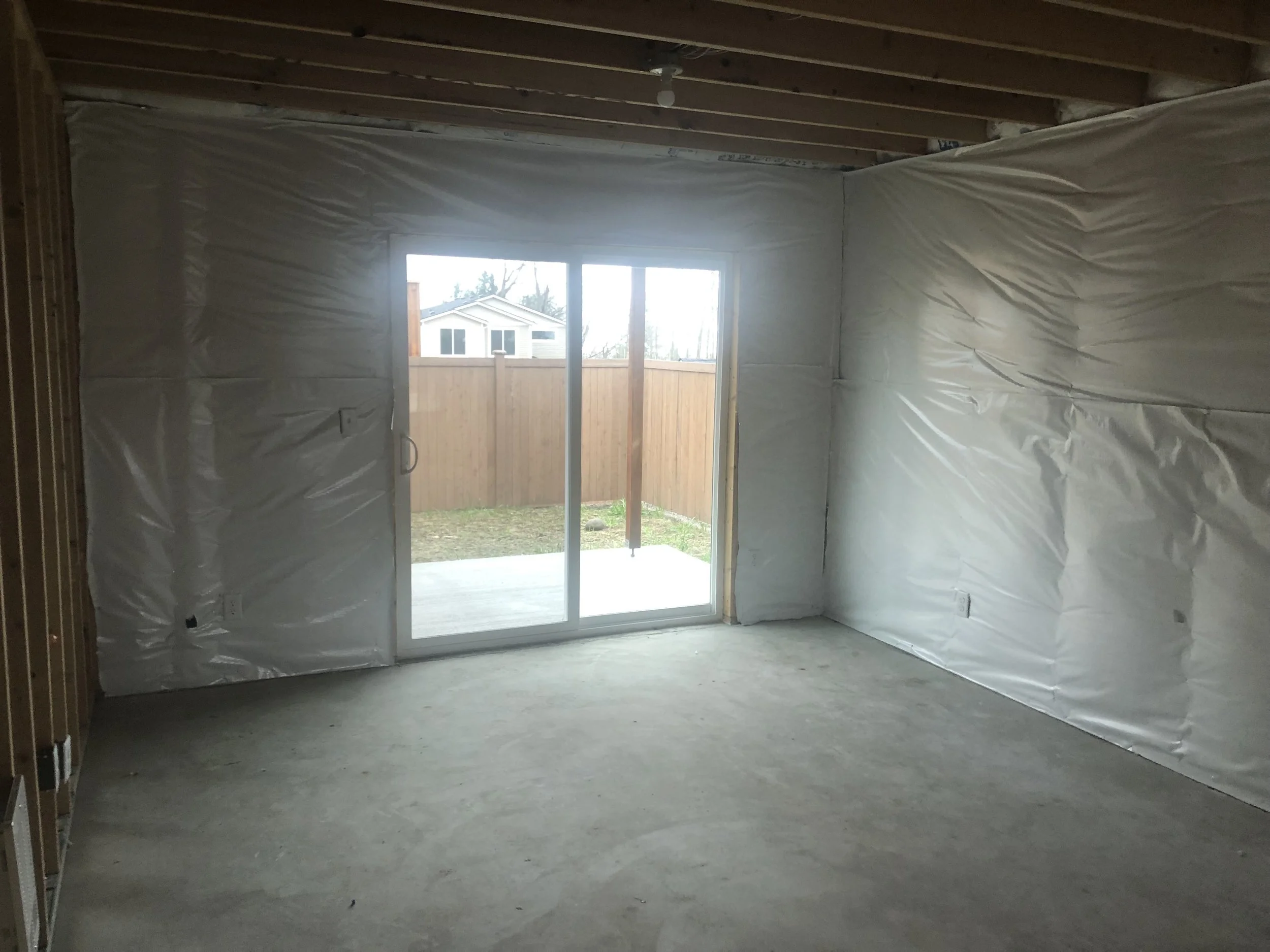 Before drywall installation in an unfinished Kirkland basement before Level 4 drywall finishing and interior painting.