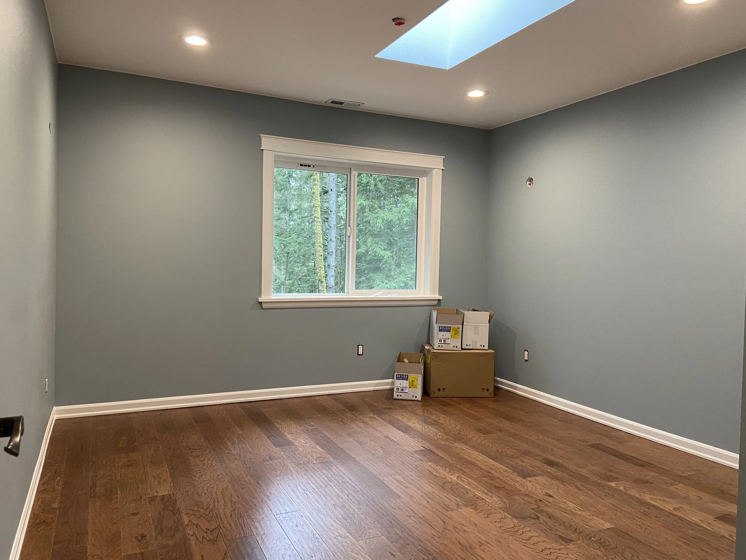 Completed ADU drywall installation in Seattle with Level 4 finish and interior painting for smooth modern walls