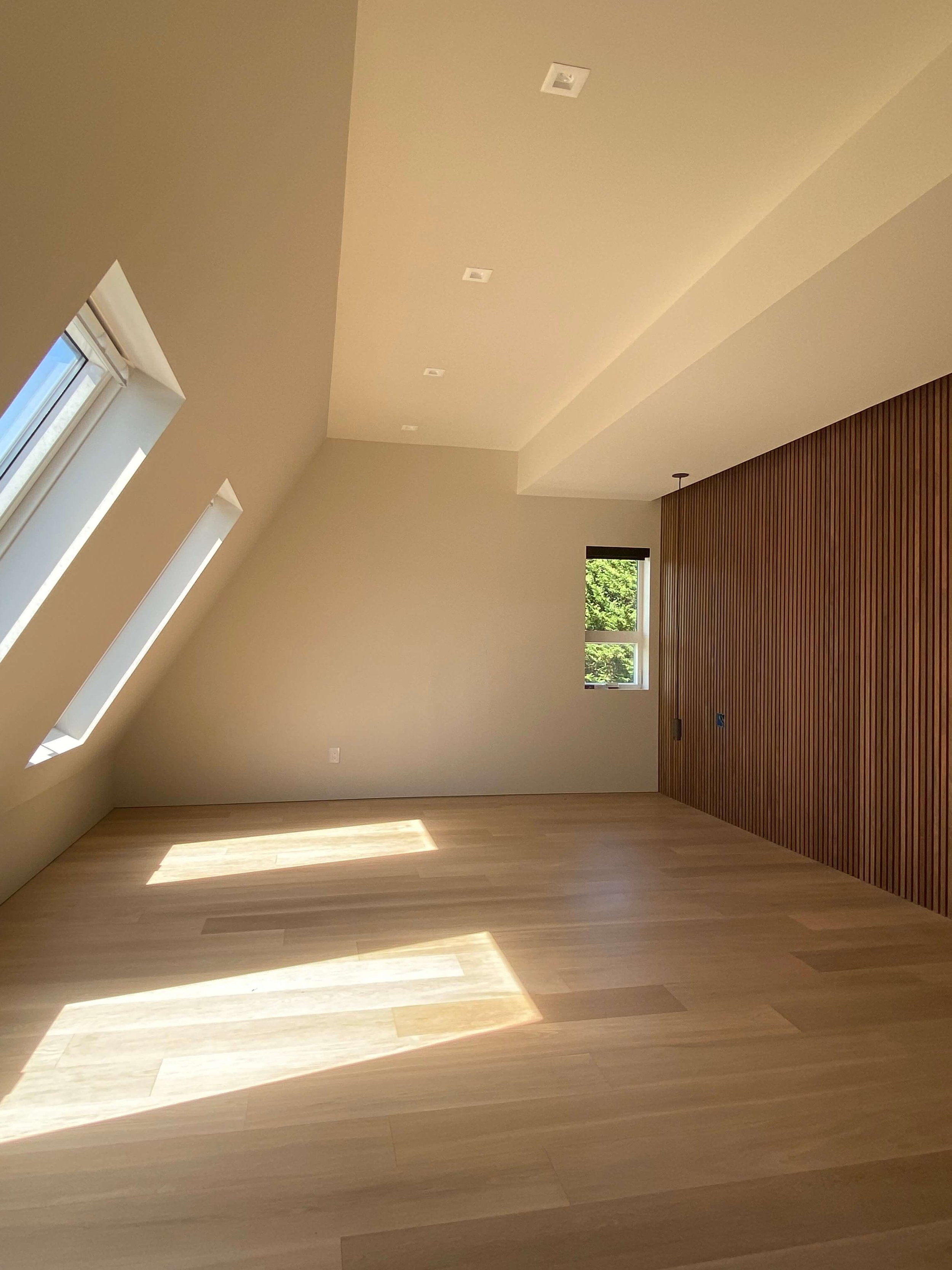 Level 5 drywall finish with recessed baseboards and reglet shadow reveals in a Redmond home remodel