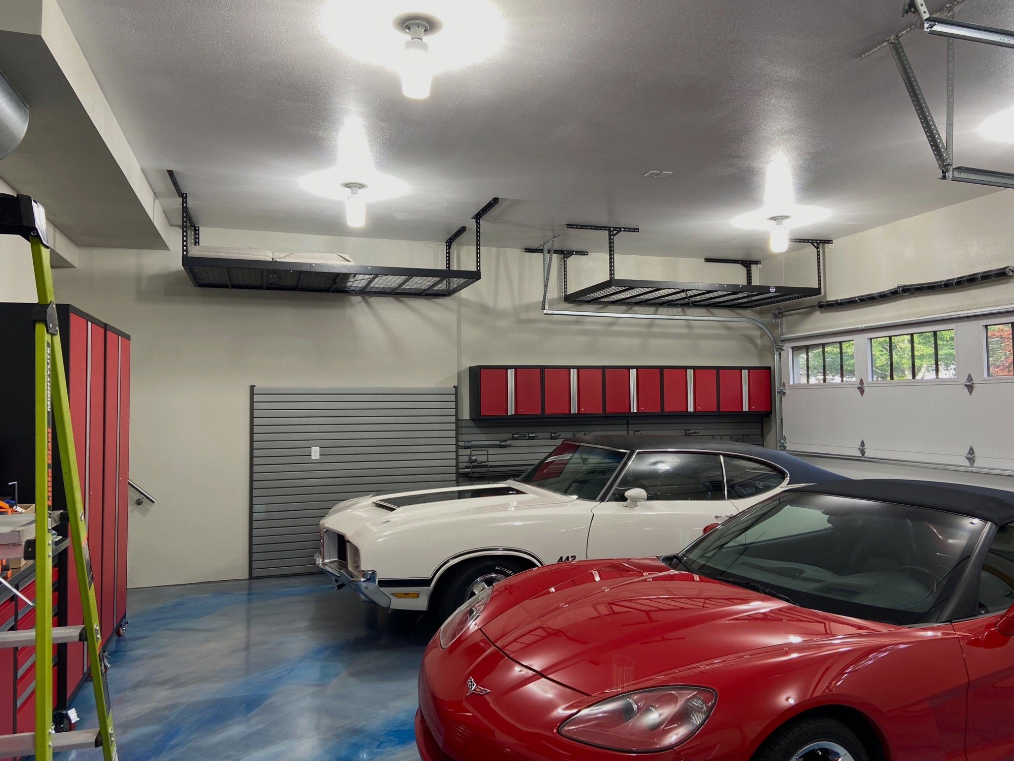 Builder-grade Level 2 garage upgraded to a smooth Level 4 drywall finish and professional paint in Bothell WA with finished walls and ceiling.