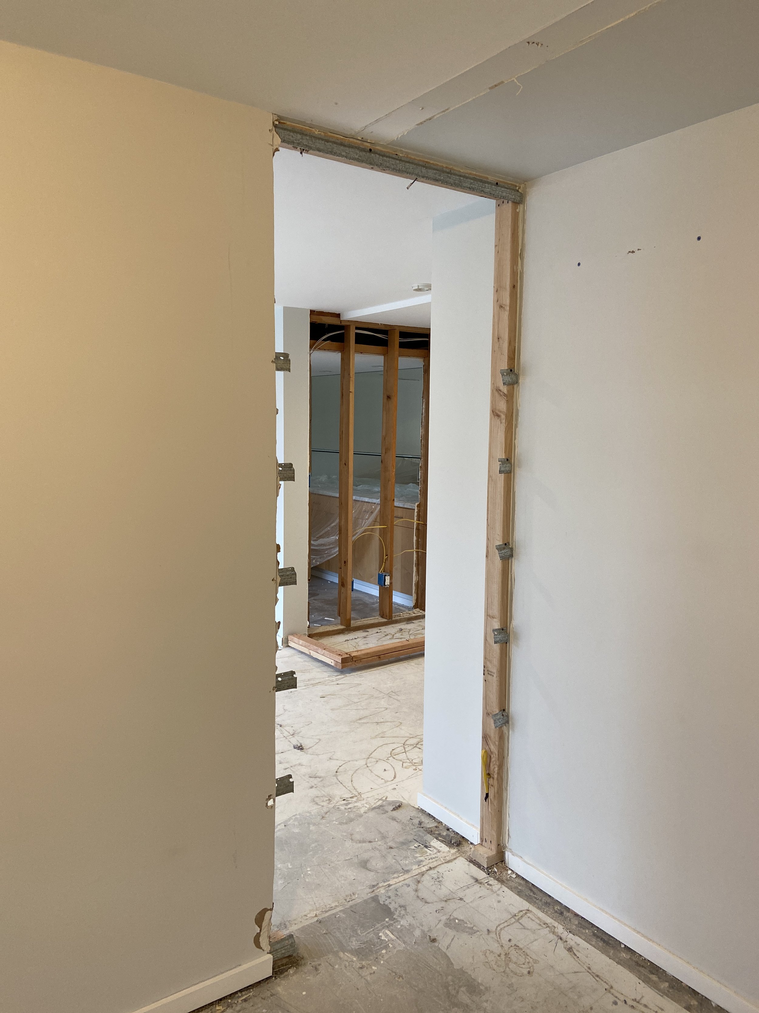 Before drywall repair in Mercer Island WA showing exposed framing and unfinished walls.