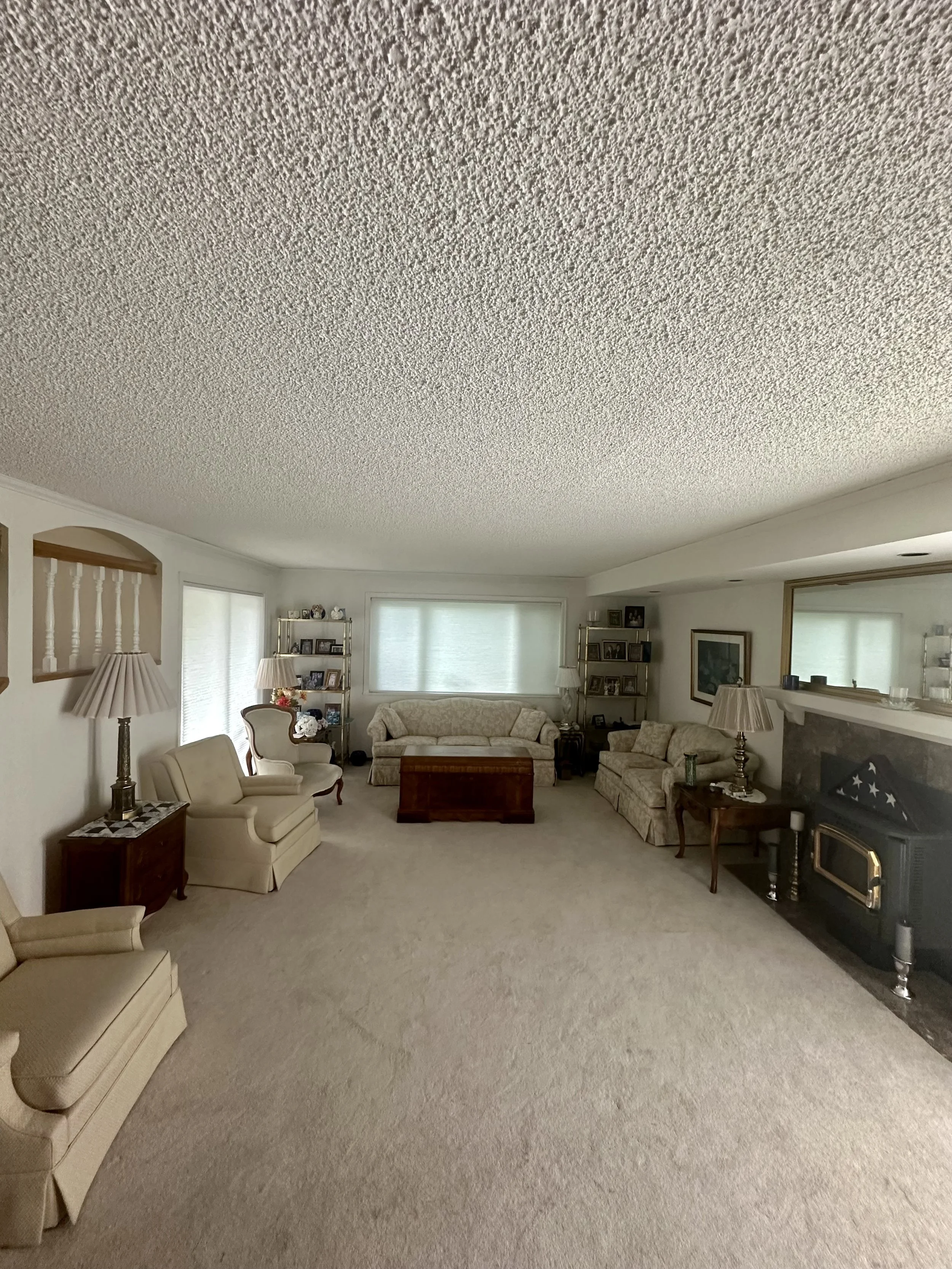 Before popcorn ceiling removal in Bellevue WA showing textured ceiling surface.