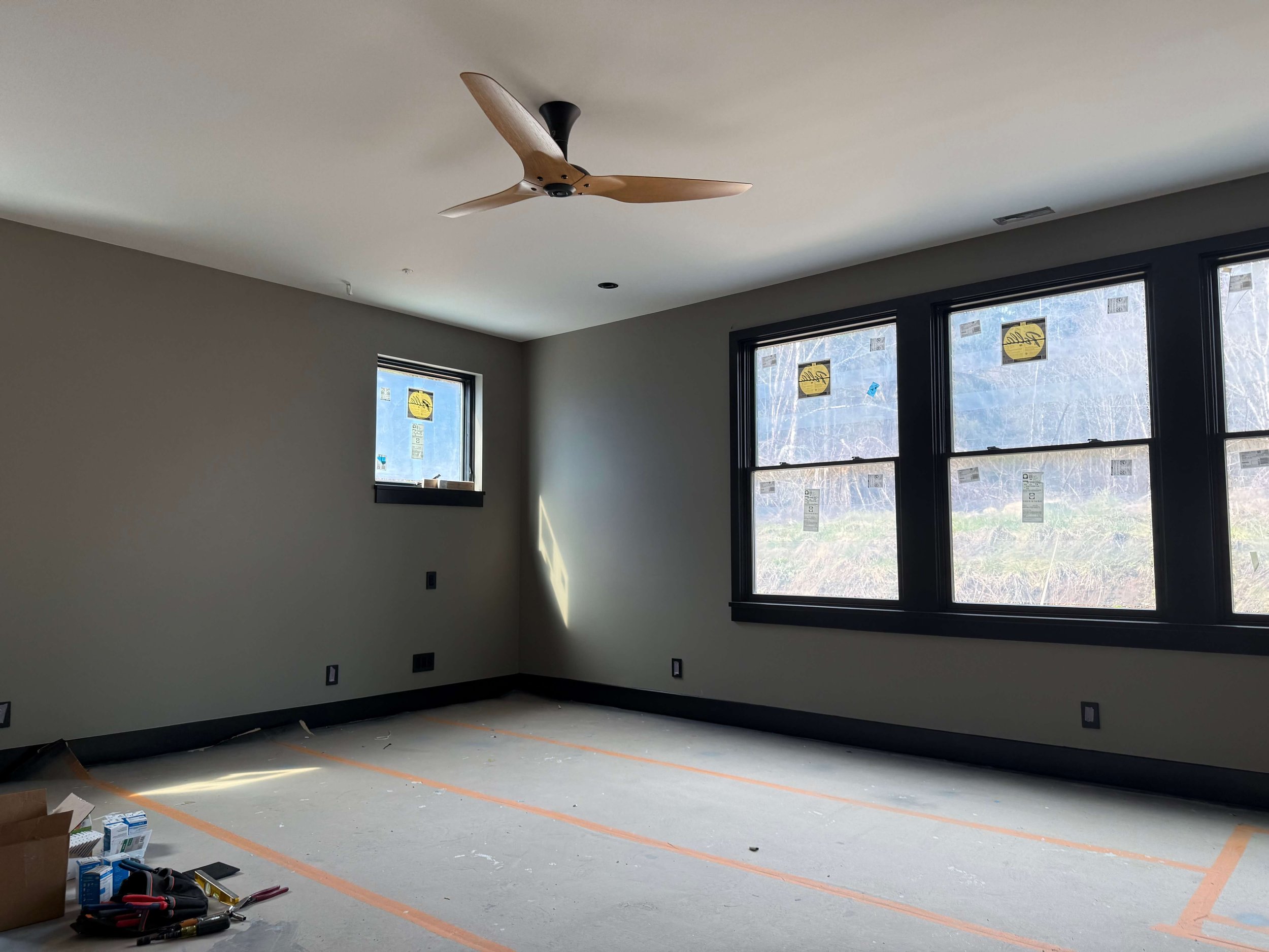 Duvall custom home interior after drywall finishing, primer, and professional wall and ceiling painting