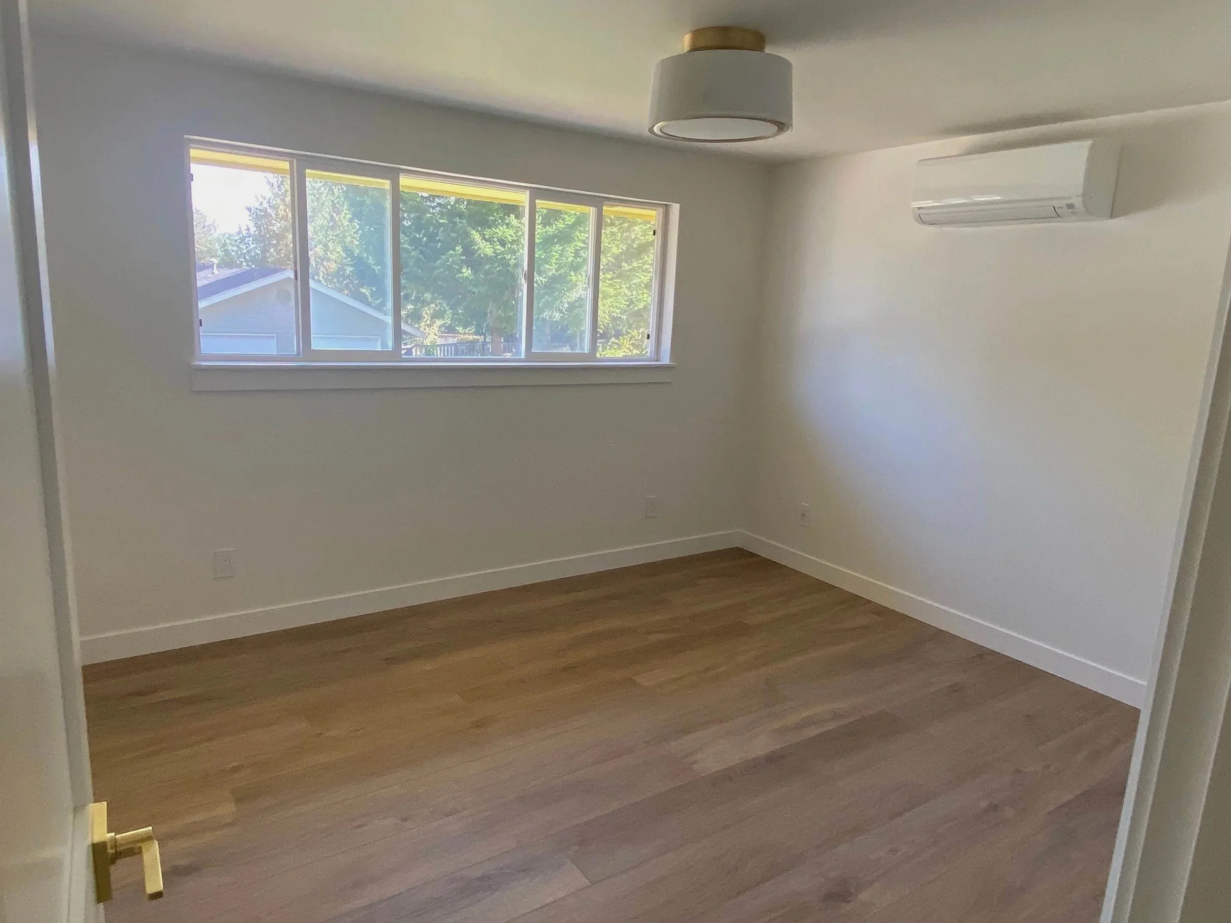Smooth skim-coated drywall walls replacing textured finish in modern home interior